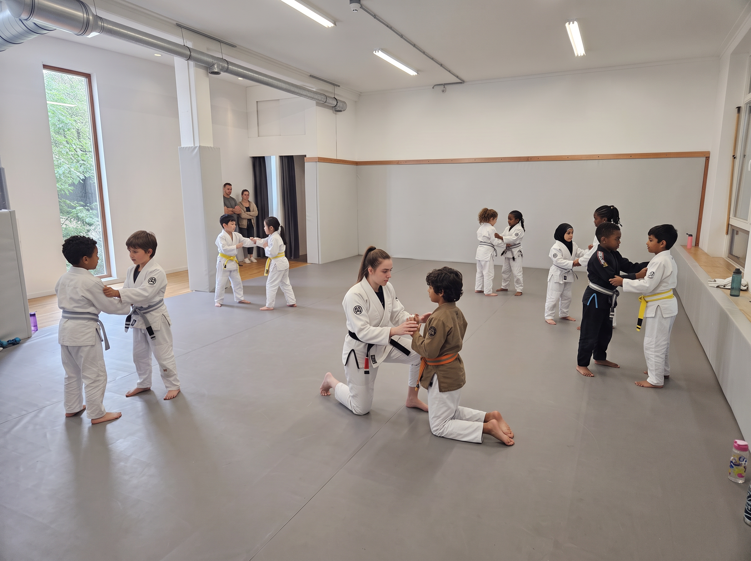 Kids laughing during a jiu-jitsu class at Dharma